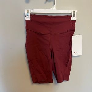 NWT base pace high rise shorts in mulled wine